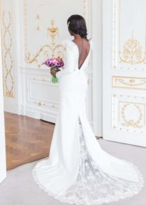 back view of a bride standing in doorway