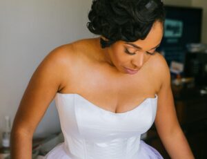 Black bride wearing a Timeless Couture designer wedding dress
